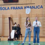 Kulturni praznik 2025 in Otroci pojejo slovenske pesmi in se veselijo